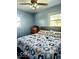 Cozy bedroom featuring a ceiling fan, and a window bringing in natural light at 4818 E 14Th St, Indianapolis, IN 46201