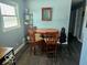 Cozy dining area with a round table and four chairs, and dark wood floors at 4818 E 14Th St, Indianapolis, IN 46201