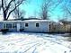 Exterior showcases the snow-covered yard surrounding the house at 4818 E 14Th St, Indianapolis, IN 46201