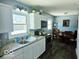 Bright kitchen featuring white cabinets, granite countertops, and stainless steel appliances at 4818 E 14Th St, Indianapolis, IN 46201