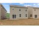 Exterior view of the home's rear showcases the siding, windows, and sliding glass door at 5123 Rolling Meadow Blvd, Indianapolis, IN 46237