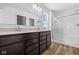 Bathroom featuring a double vanity, a large mirror, and a glass shower enclosure at 5123 Rolling Meadow Blvd, Indianapolis, IN 46237