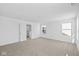 Bright bedroom with neutral carpet, trim, and natural light at 5123 Rolling Meadow Blvd, Indianapolis, IN 46237