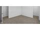 Spacious bedroom with neutral carpet and walk-in closet, offering comfort and functionality at 5123 Rolling Meadow Blvd, Indianapolis, IN 46237