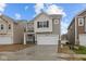 Charming two-story home features a two-car garage, covered entry, and stone accents at 5123 Rolling Meadow Blvd, Indianapolis, IN 46237