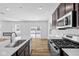 Well-designed kitchen featuring stainless steel appliances and a seamless flow to the living area at 5123 Rolling Meadow Blvd, Indianapolis, IN 46237