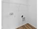 Bright laundry room featuring modern hookups and sleek wire shelving at 5123 Rolling Meadow Blvd, Indianapolis, IN 46237