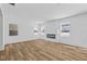 Bright living room showcasing modern fireplace and beautiful, light-filled windows offering serene outdoor views at 5123 Rolling Meadow Blvd, Indianapolis, IN 46237