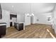 Open-concept living space with hardwood floors, modern lighting, and abundant natural light at 5123 Rolling Meadow Blvd, Indianapolis, IN 46237