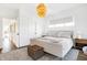 Bright bedroom with a king-size bed and a stylish chandelier at 531 Fulton St, Indianapolis, IN 46202