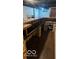 Unfinished basement bar with brick and wood features at 5414 E 11Th St, Indianapolis, IN 46219