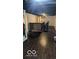 Brick bar with dark wood flooring in the basement at 5414 E 11Th St, Indianapolis, IN 46219