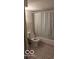 Clean bathroom with shower/tub and patterned tile floor at 5414 E 11Th St, Indianapolis, IN 46219