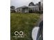 Ranch style home with stone facade and spacious lawn at 5414 E 11Th St, Indianapolis, IN 46219
