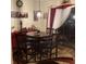 Cozy dining area with a round table, four chairs, and decorative accents at 7569 Farm View E Cir, Indianapolis, IN 46256