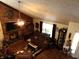 Spacious living room featuring a brick fireplace and hardwood floors at 7569 Farm View E Cir, Indianapolis, IN 46256