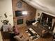 Bright and airy living room with wood floors and fireplace, viewed from above at 7569 Farm View E Cir, Indianapolis, IN 46256