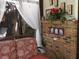 Sunroom with wicker furniture and brick wall at 7569 Farm View E Cir, Indianapolis, IN 46256