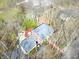 Aerial view of gray roof, tree coverage, brick walkway and mature trees at 7830 Ridgeland Dr, Indianapolis, IN 46250