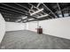 Finished basement with carpeted floor and painted ceiling at 7830 Ridgeland Dr, Indianapolis, IN 46250