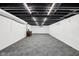 Large finished basement featuring exposed ceiling at 7830 Ridgeland Dr, Indianapolis, IN 46250