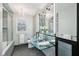 Stylish bathroom featuring glass vanity with vessel sink, decorative lighting, and a glass enclosed shower at 7830 Ridgeland Dr, Indianapolis, IN 46250