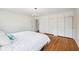 Spacious bedroom featuring hardwood floors, a cozy queen-sized bed, and ample closet space at 7830 Ridgeland Dr, Indianapolis, IN 46250