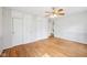 Bedroom featuring hardwood floors, two closets and patterned wallpaper at 7830 Ridgeland Dr, Indianapolis, IN 46250