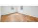 Bright bedroom with hardwood floors and natural light streaming through two windows at 7830 Ridgeland Dr, Indianapolis, IN 46250