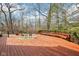 Large wooden deck with built-in seating overlooking the backyard at 7830 Ridgeland Dr, Indianapolis, IN 46250