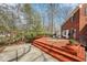 Multi-level deck with seating areas and a view of the landscaped backyard at 7830 Ridgeland Dr, Indianapolis, IN 46250