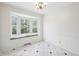 Bright dining room features a bay window with cushioned seating and charming chandelier at 7830 Ridgeland Dr, Indianapolis, IN 46250