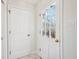 Bright entryway features a tiled floor, storage closet, and backyard access at 7830 Ridgeland Dr, Indianapolis, IN 46250