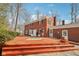 Back exterior of brick house showing a multi-level deck at 7830 Ridgeland Dr, Indianapolis, IN 46250