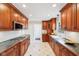 Well-equipped kitchen featuring wood cabinets, modern appliances, and ample counter space at 7830 Ridgeland Dr, Indianapolis, IN 46250