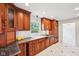 Spacious kitchen boasts custom cabinets, modern appliances, and tiled floor at 7830 Ridgeland Dr, Indianapolis, IN 46250