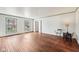 Sunlit living room with pristine hardwood floors and classic window trim at 7830 Ridgeland Dr, Indianapolis, IN 46250