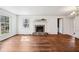Bright living room features hardwood floors, natural light, and a fireplace at 7830 Ridgeland Dr, Indianapolis, IN 46250