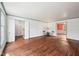 Expansive living room with gleaming hardwood floors and views into other living spaces at 7830 Ridgeland Dr, Indianapolis, IN 46250