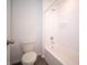 A clean, well-lit bathroom with a white bathtub and shower combo and standard toilet at 801 Blaine Dr, Whiteland, IN 46184