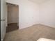 Bedroom with neutral carpet, multiple closets, electrical outlets, and neutral paint at 801 Blaine Dr, Whiteland, IN 46184