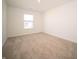 Bedroom featuring neutral carpet, white walls, and a window offering natural light at 801 Blaine Dr, Whiteland, IN 46184