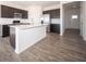 Modern kitchen boasts stainless appliances, white countertops, an island and dark cabinetry at 801 Blaine Dr, Whiteland, IN 46184