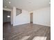 Open-concept living room featuring recessed lighting and durable wood-look flooring throughout the space at 801 Blaine Dr, Whiteland, IN 46184