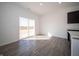 Bright living area with sliding glass doors, hardwood floors, and natural light at 801 Blaine Dr, Whiteland, IN 46184