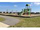 Community playground with a walking path, swings, and a play structure for children to enjoy at 801 Blaine Dr, Whiteland, IN 46184