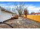 Backyard with a new wood fence and access to a wooden deck at 8810 Beechwood Ave, Indianapolis, IN 46219