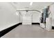 Attached garage with ample storage space and HVAC systems at 8810 Beechwood Ave, Indianapolis, IN 46219
