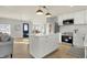 Modern kitchen with island, stainless steel appliances, and white cabinetry at 8810 Beechwood Ave, Indianapolis, IN 46219