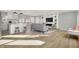 Modern kitchen with white cabinets, quartz countertops and stainless steel appliances at 8810 Beechwood Ave, Indianapolis, IN 46219